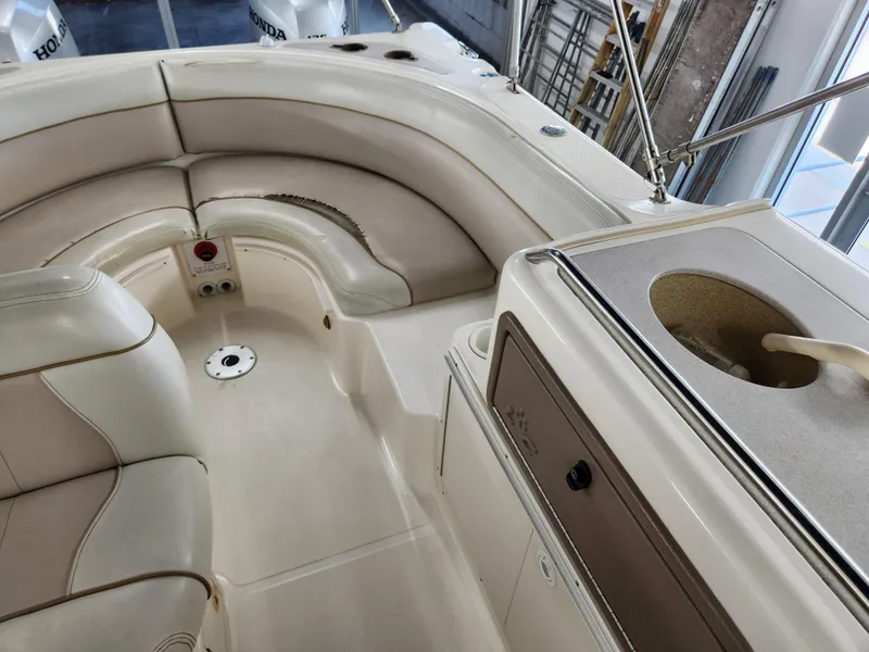 Slide: The Image of Interior of a 2000 World Cat 266 Leisure Cat boat with seating and sink. - 15