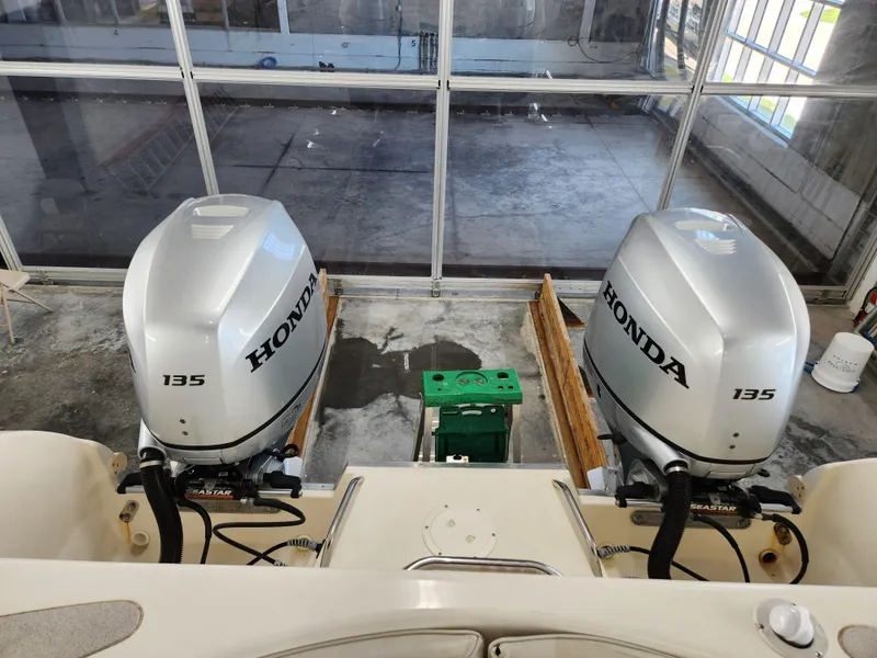 Slide: The Image of Twin Honda 135 outboard engines on a 2000 World Cat 266 Leisure Cat boat. - 17