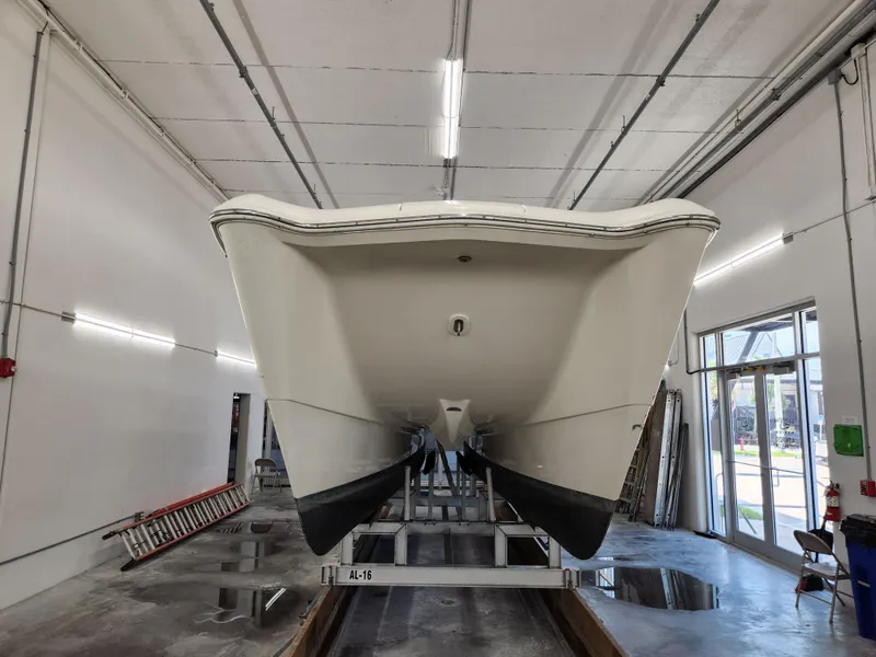 Slide: The Image of 2000 World Cat 266 Leisure Cat boat in a garage, front view. - 2