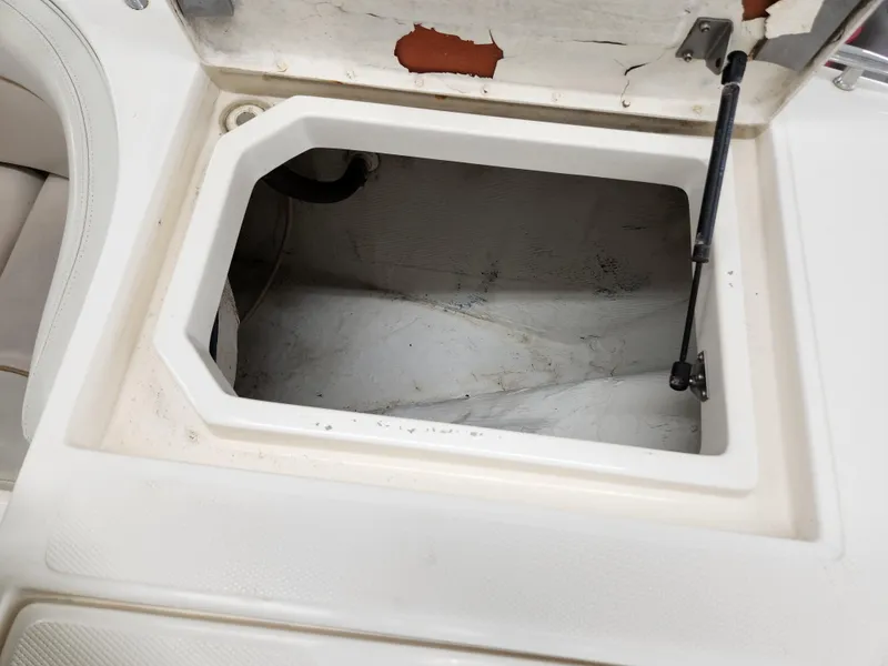 Slide: The Image of Open storage compartment on a 2000 World Cat 266 Leisure Cat boat. - 26