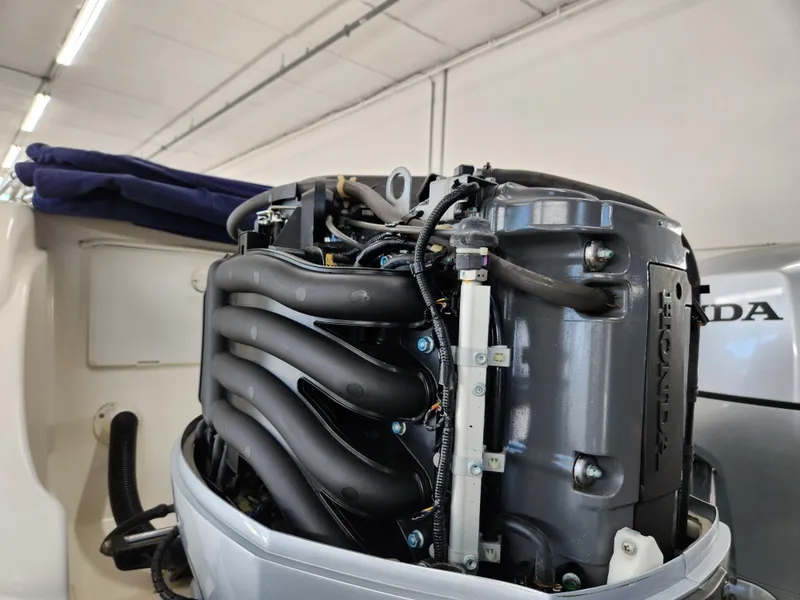 Slide: The Image of Honda outboard engine on a 2000 World Cat 266 Leisure Cat boat. - 29