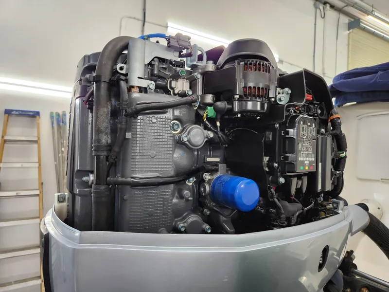 Slide: The Image of Close-up of a 2000 World Cat 266 Leisure Cat engine in a workshop setting. - 30