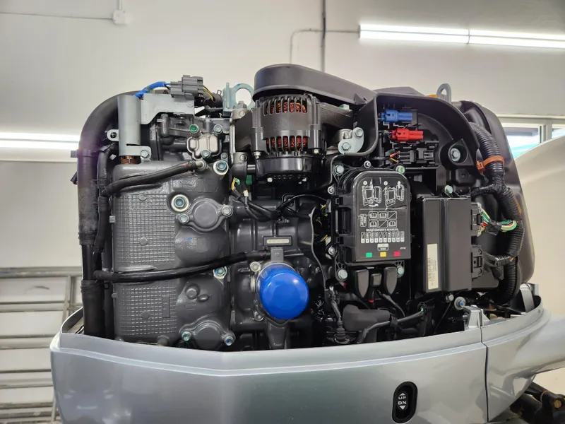 Slide: The Image of Close-up of a 2000 World Cat 266 Leisure Cat engine in a workshop setting. - 31