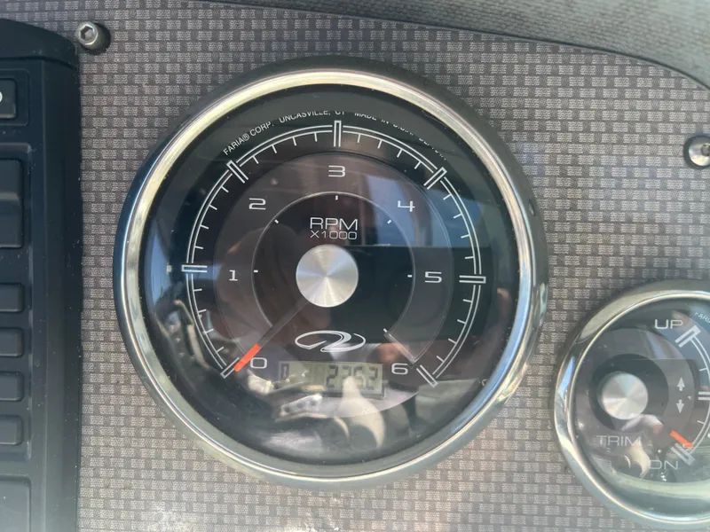 Slide: The Image of Close-up of 2013 Regal 24 FasDeck RX tachometer displaying RPM gauge. - 11