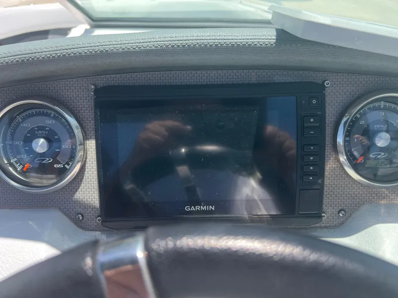 Slide: The Image of Dashboard of a 2013 Regal 24 FasDeck RX with Garmin display and gauges. - 13