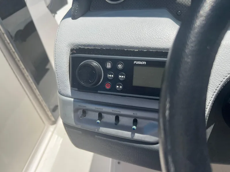 Slide: The Image of Control panel of a 2013 Regal 24 FasDeck RX boat with Fusion audio system. - 15