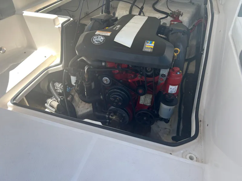 Slide: The Image of Engine compartment of a 2013 Regal 24 FasDeck RX boat, showcasing the motor. - 21
