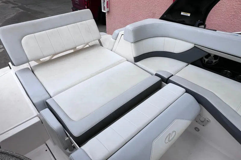 Slide: The Image of 2013 Regal 24 FasDeck RX boat interior with white and gray seating arrangement. - 27