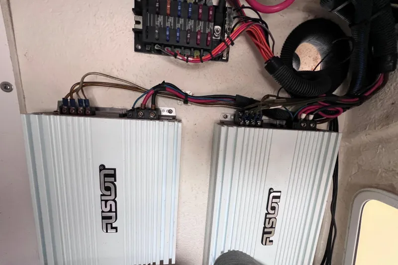 Slide: The Image of Audio amplifiers and wiring inside a 2013 Regal 24 FasDeck RX boat. - 33