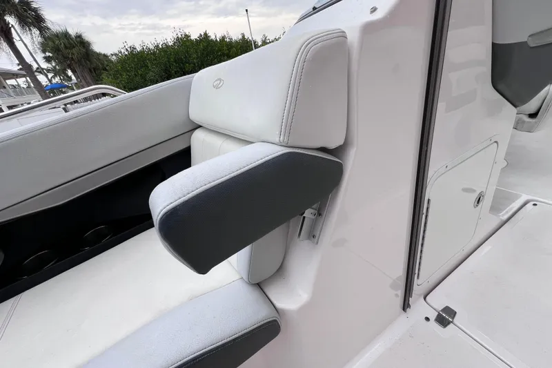 Slide: The Image of 2013 Regal 24 FasDeck RX boat interior with white and gray seating. - 34