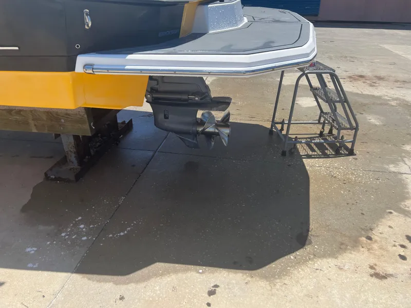 Slide: The Image of Rear view of a 2013 Regal 24 FasDeck RX boat on a concrete surface. - 4