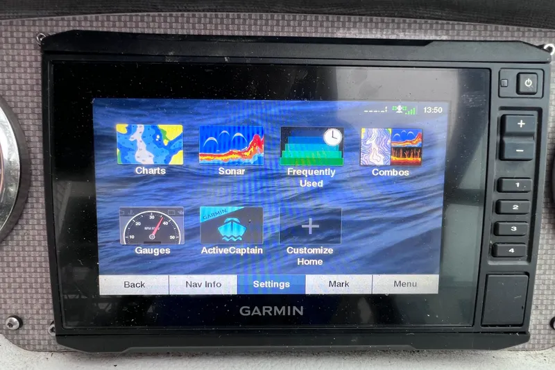 Slide: The Image of Garmin marine GPS display on 2013 Regal 24 FasDeck RX, showing navigation and sonar options. - 40