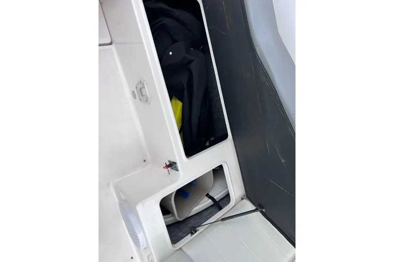 Slide: The Image of Open storage compartment in 2013 Regal 24 FasDeck RX boat interior. - 43