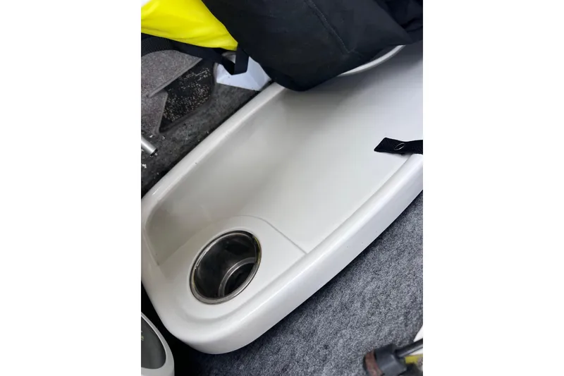 Slide: The Image of 2013 Regal 24 FasDeck RX boat interior with cup holder and storage area. - 44