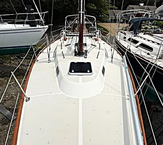Slide: The Image of 1993 Tartan 3500 sailboat deck view, showcasing sleek design and rigging details. - 11