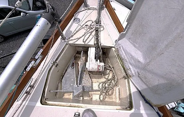 Slide: The Image of Anchor compartment of a 1993 Tartan 3500 sailboat, featuring ropes and chains. - 12