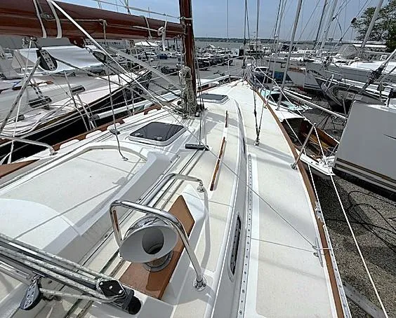 Slide: The Image of Sailboat deck view of 1993 Tartan 3500, docked among other boats. - 13