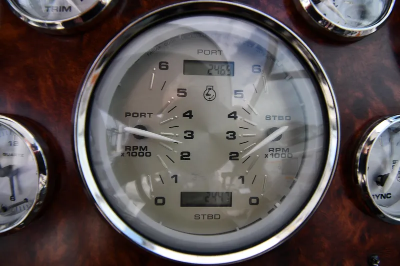 Slide: The Image of Close-up of 2014 Rinker 310 Express Cruiser tachometer displaying RPM and temperature. - 15