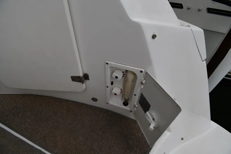 Slide: The Image of 2014 Rinker 310 Express Cruiser interior panel with open access compartment. - 30