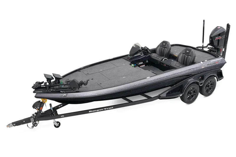 The Image of 2025 Ranger Z521 boat on trailer, parked on concrete, under clear blue sky. - 1