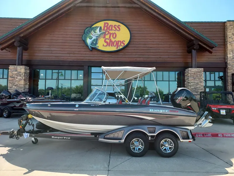 The Image of 2025 Ranger 1850MS boat displayed outside Bass Pro Shops store. - 0