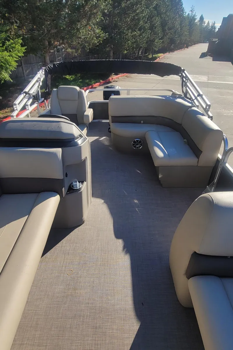 Slide: The Image of 2025 Sun Tracker Party Barge 18 DLX pontoon boat with spacious seating and modern design. - 6