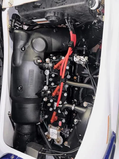 Slide: The Image of 2001 Yamaha WaveRunner GP1200R engine with red wires and black components. - 16