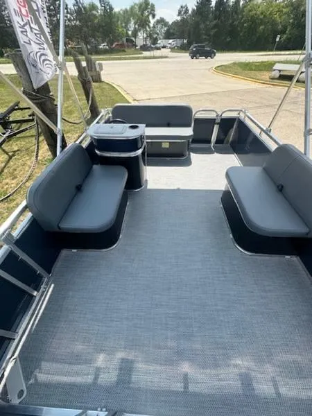 Slide: The Image of 2026 Paddle King Lo Pro Cruiser pontoon boat with canopy in showroom. - 4