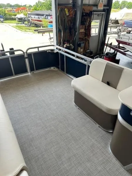 Slide: The Image of 2026 Paddle King Lo Pro Cruiser XL pontoon interior with seating and open deck space. - 6