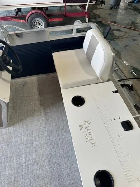 Slide: The Image of 2026 Paddle King Lo Pro Cruiser XL interior with seating and steering wheel. - 7