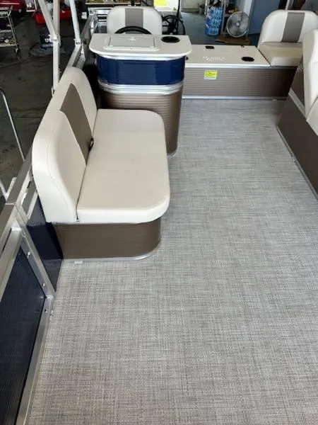Slide: The Image of 2026 Paddle King Lo Pro Cruiser XL interior with beige seating and gray flooring. - 8
