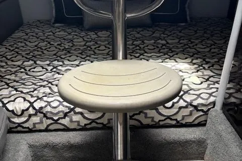 Slide: The Image of 2017 Formula 350 CBR cabin interior with patterned bedding and a central seat. - 11