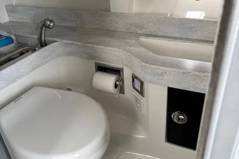 Slide: The Image of 2017 Formula 350 CBR boat bathroom with modern fixtures and sleek countertop design. - 12