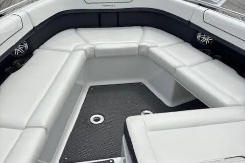 Slide: The Image of 2017 Formula 350 CBR boat interior with white cushioned seating and black flooring. - 16