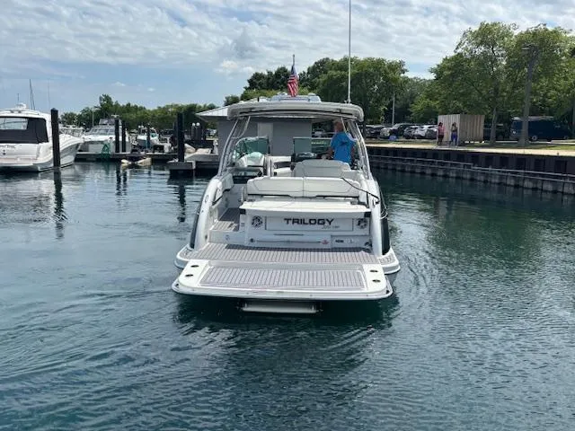 Slide: The Image of 2017 Formula 350 CBR boat named Trilogy docked in a marina. - 3