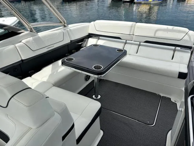 Slide: The Image of 2017 Formula 350 CBR boat interior with white seating and a central table. - 7