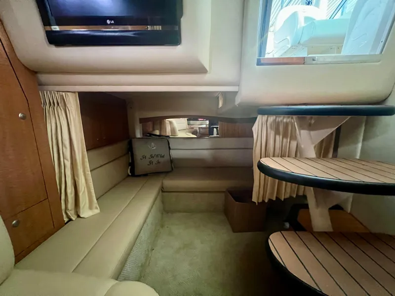 Slide: The Image of Interior of 2006 Sea Ray 340 Sundancer yacht with seating and TV. - 24