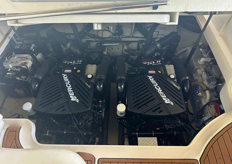 Slide: The Image of Engine compartment of a 2006 Sea Ray 340 Sundancer with twin Mercury engines. - 25