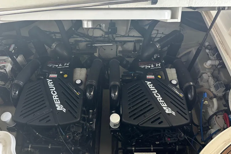 Slide: The Image of Twin Mercury engines in a 2006 Sea Ray 340 Sundancer boat engine compartment. - 26