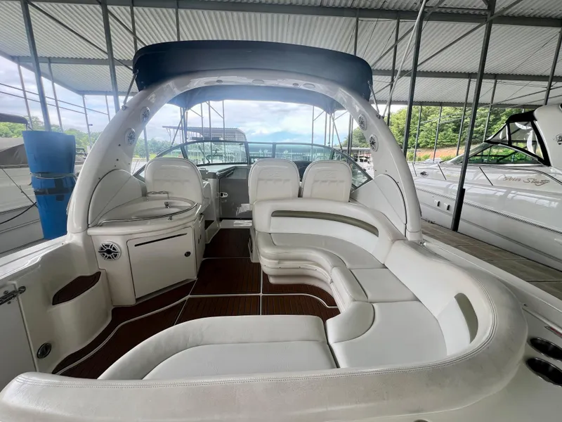 Slide: The Image of 2006 Sea Ray 340 Sundancer yacht interior with white seating and wood flooring. - 7