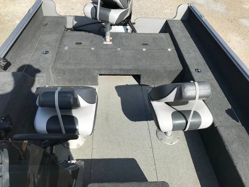 Slide: The Image of 2011 Lund 1775 Impact boat interior with two seats and carpeted flooring. - 13