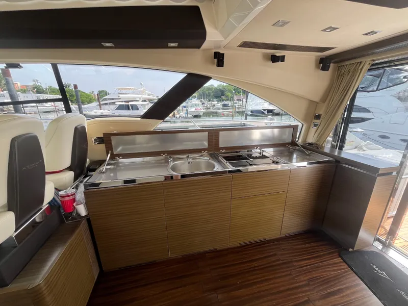 Slide: The Image of Luxurious interior of 2014 Azimut 55S yacht with modern kitchen amenities. - 14