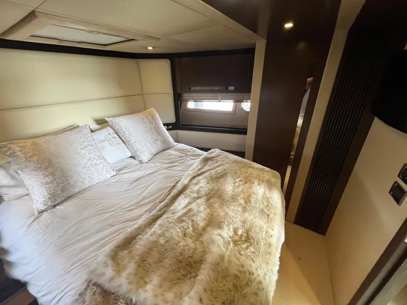 Slide: The Image of Luxurious bedroom interior of 2014 Azimut 55S yacht with plush bedding and elegant decor. - 26