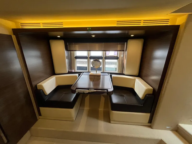 Slide: The Image of Luxurious interior of 2014 Azimut 55S yacht with elegant seating and table. - 31