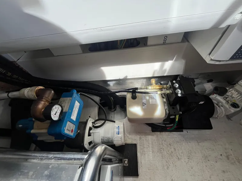 Slide: The Image of Engine room of a 2014 Azimut 55S yacht, showcasing mechanical components and equipment. - 36