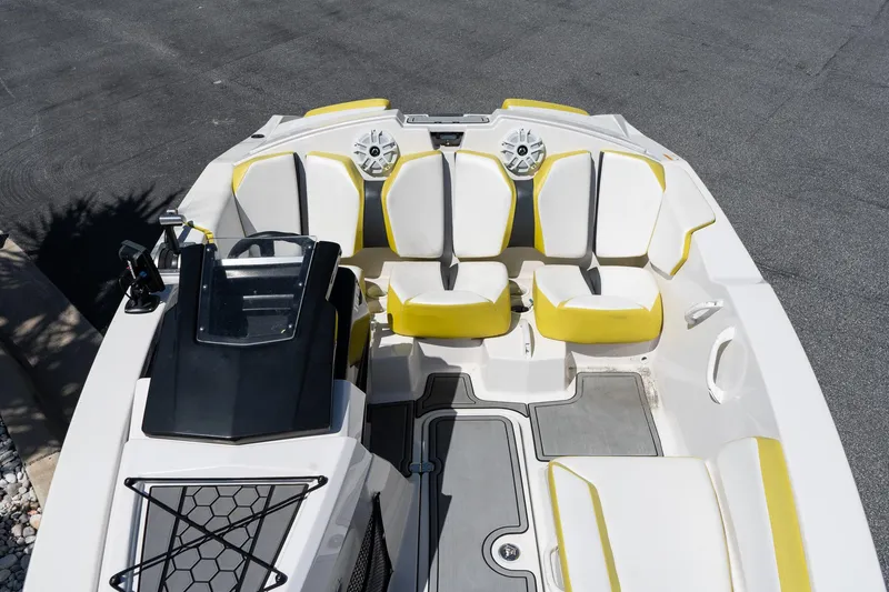 Slide: The Image of 2017 Scarab 165 G boat interior with yellow and white seating, overhead view. - 5