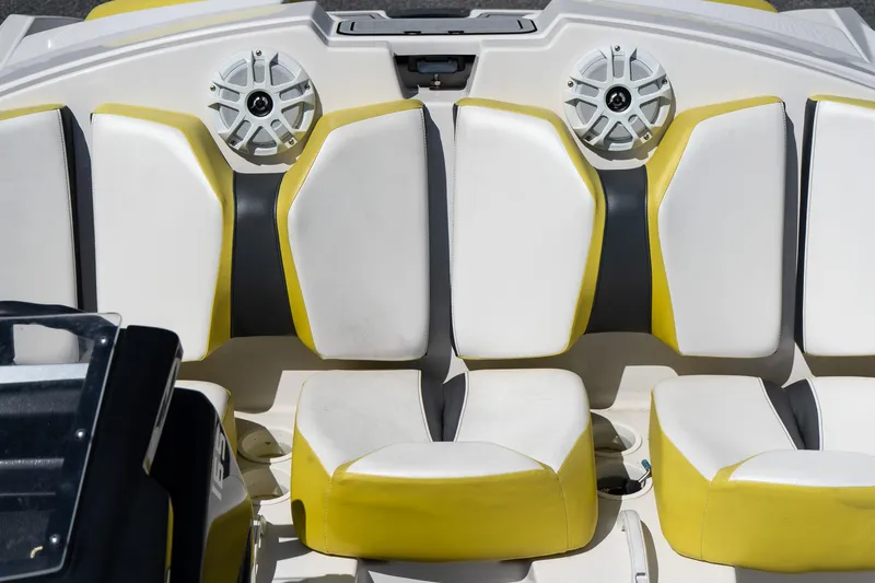 Slide: The Image of Interior seating of a 2017 Scarab 165 G boat with yellow and white upholstery. - 6