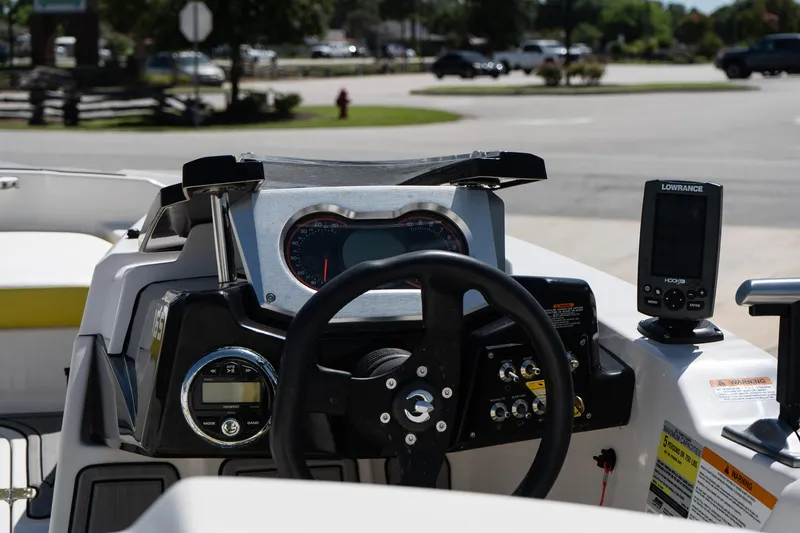 Slide: The Image of 2017 Scarab 165 G boat dashboard with steering wheel and navigation system. - 8