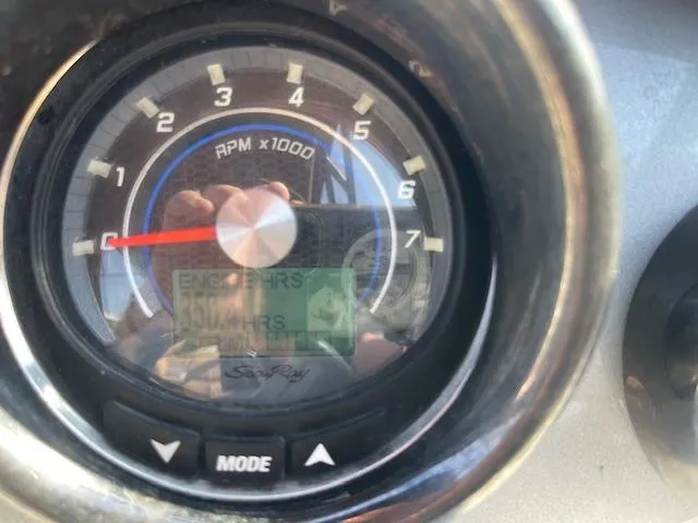 Slide: The Image of Close-up of 2017 Sea Ray SDX 270 tachometer displaying RPM and engine hours. - 6