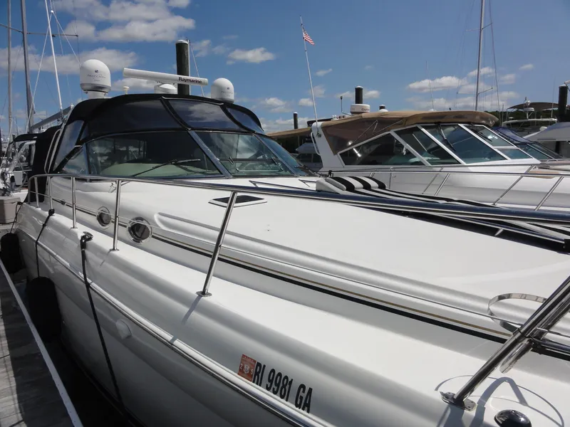 The Image of 2003 Sea Ray 380 Sundancer yacht docked under a clear blue sky. - 0